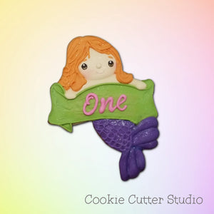 Mermaid holding banner cookie